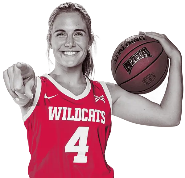 Female basketball player holding a basketball
