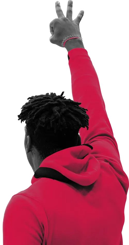 Man in a hoodie holding up three fingers